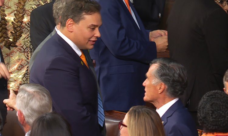 Rep. George Santos, R-N.Y., speaks with Sen. Mitt Romney, R-Utah, spoke before the State of the Union Tuesday. Santos would later disregard Romney's remarks, and chose to make himself a spectacle during the speech. Credit: NBC